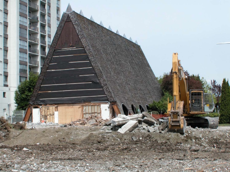 Excavator clearing the site at 7100 Granville Avenue in 2002 following the removal of the old parish hall, original church office, and entrance wing. This work was part of a larger project that included the restoration of the main A-frame church building.