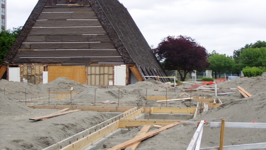 A photograph showing the deep excavation and perimeter drainage work for the new multi-use facility at Trinity Lutheran Church in Richmond, BC.