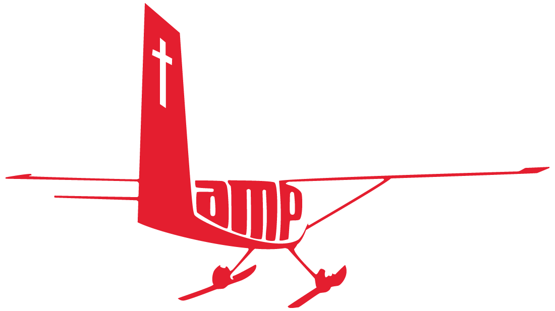 Logo for the Lutheran Association of Missionaries and Pilots (LAMP), featuring a Christian cross with an airplane silhouette flying across the center. The body of the airplane forms the letters LAMP.